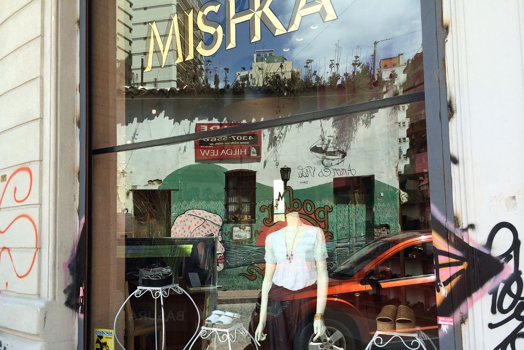 10 Graffiti Street Art Reflected In The Window Of Mishka On Balcarce San Telmo Buenos Aires